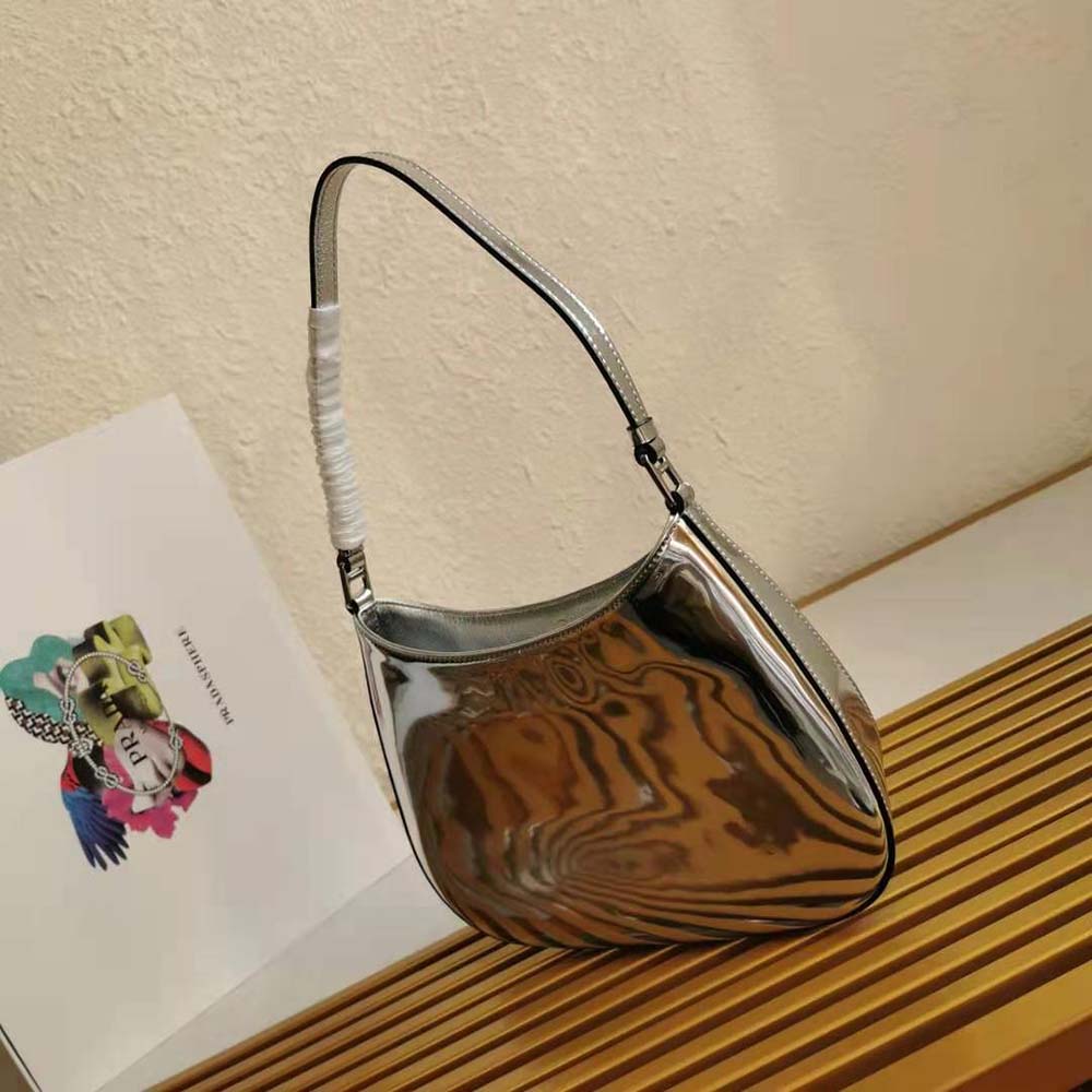 Side profile showing curved silhouette of Prada Cleo Brushed Leather Shoulder Bag-Silver