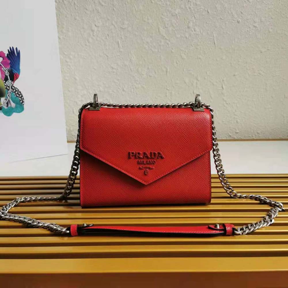 Close-up of red Saffiano leather texture and tonal hardware