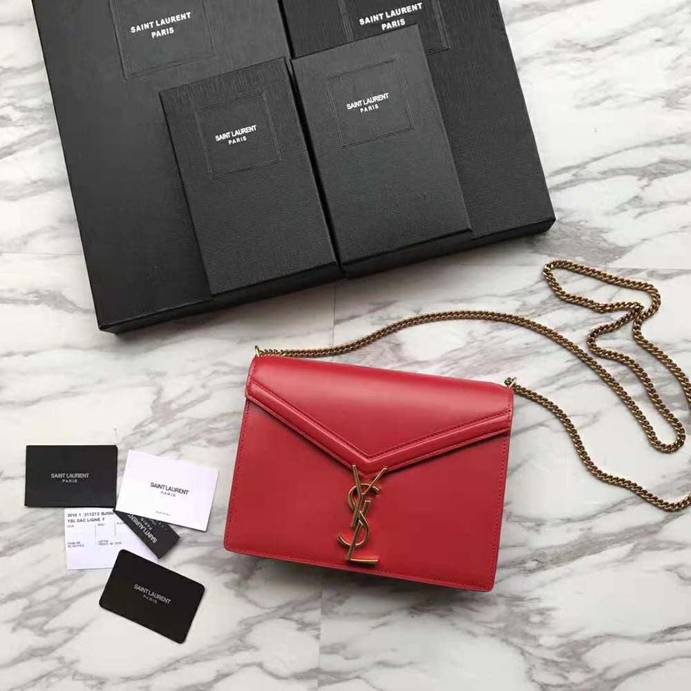 Side profile showing compact silhouette of Saint Laurent YSL Cassandra red shoulder bag