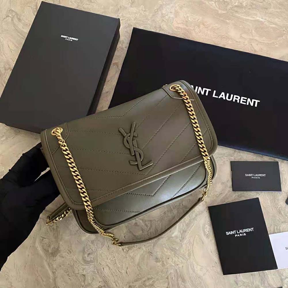 Side angle showing adjustable strap detail of Saint Laurent YSL Niki Baby