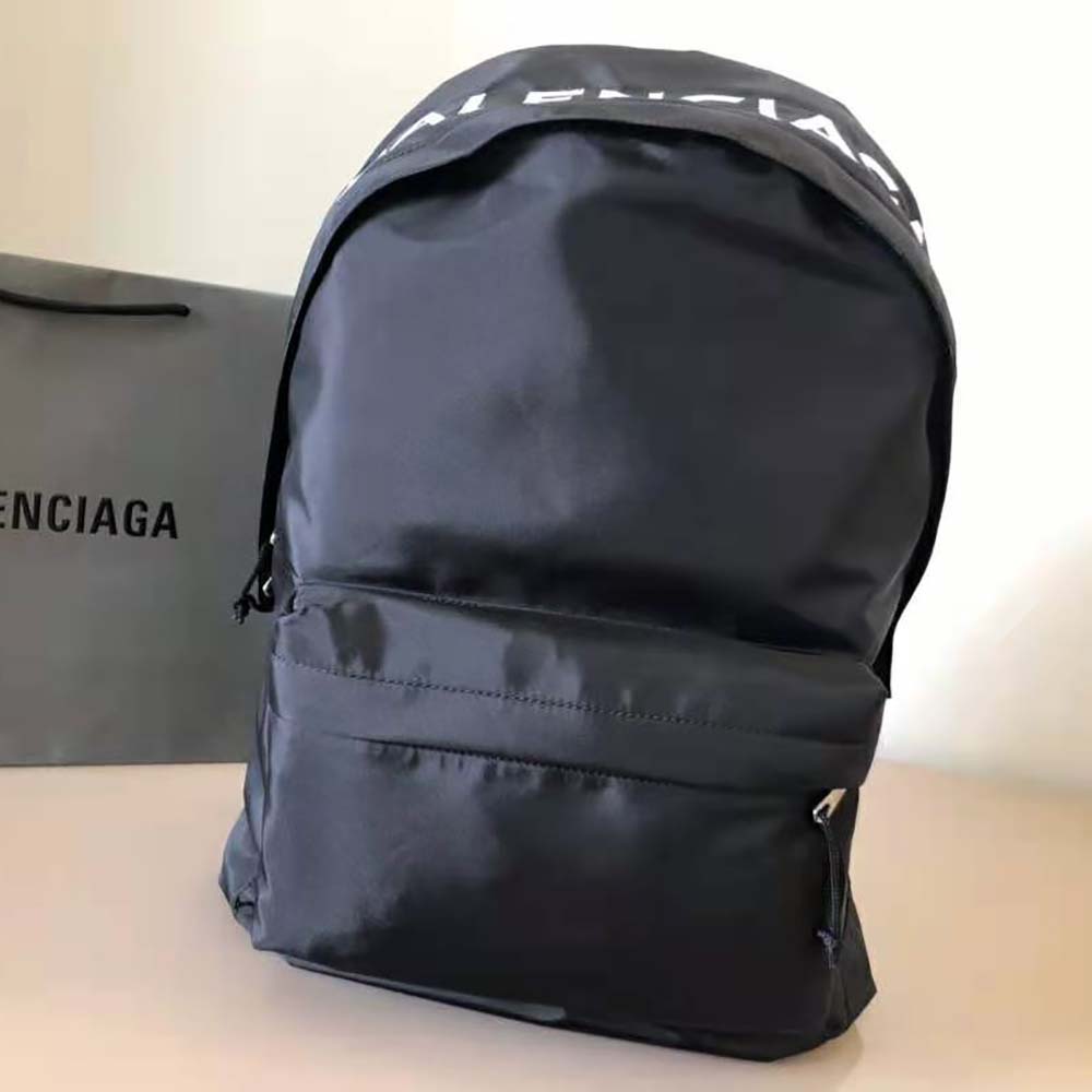 Close-up of white embroidered logo on Balenciaga Men Wheel Backpack