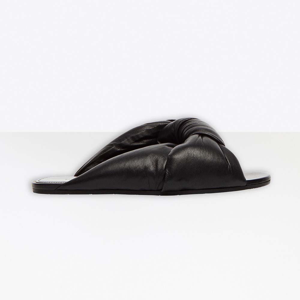 Side view of Balenciaga Women Drapy Flat Sandal in black lambskin