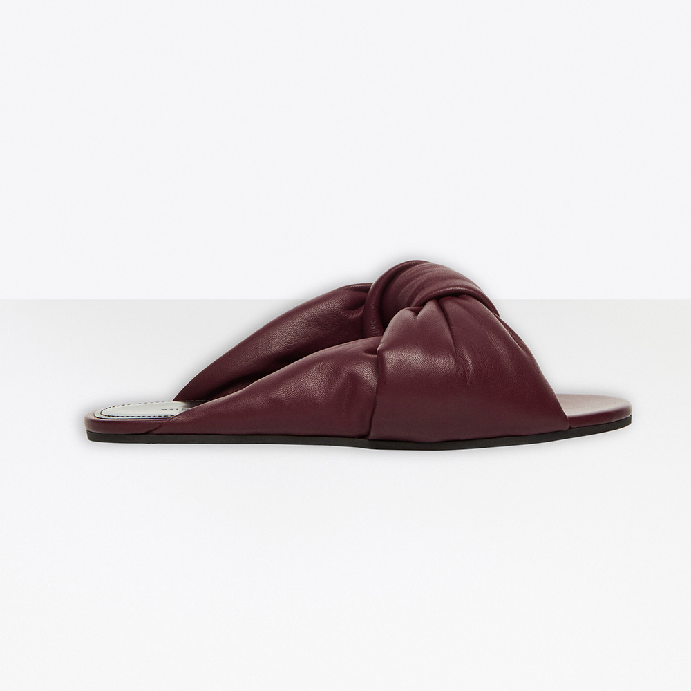 Side view of Balenciaga Women Drapy Flat Sandal in dark red lambskin