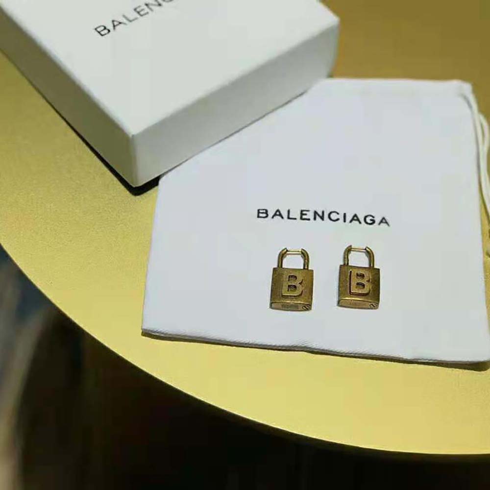Side profile showcasing lock silhouette of Balenciaga Women Lock Earrings