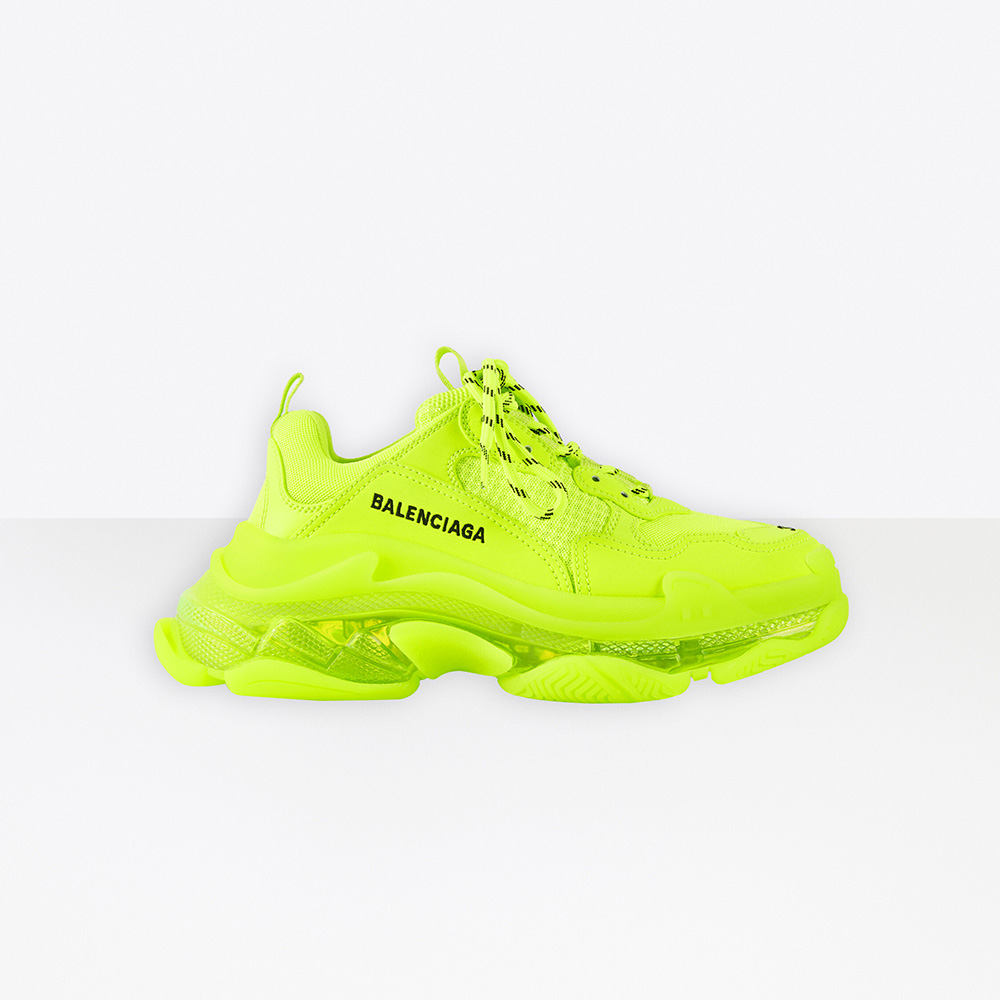Side profile of Balenciaga Women Triple S Clear Sole Sneaker in neon yellow