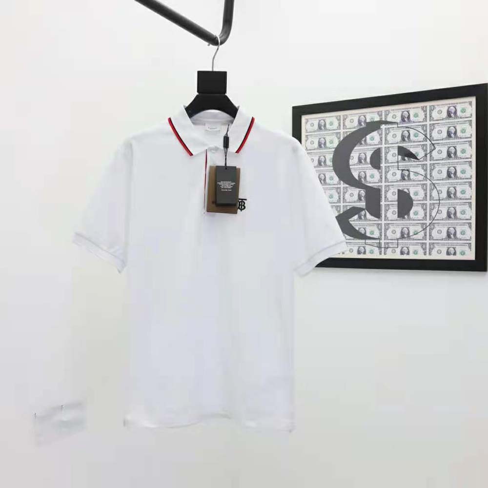 Close-up of iconic stripe placket on Burberry men's white polo shirt