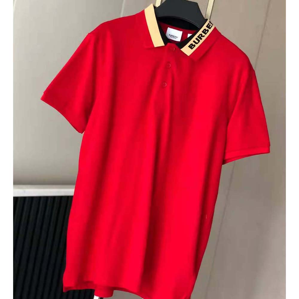 Close-up of embroidered Burberry logo on red cotton pique polo shirt