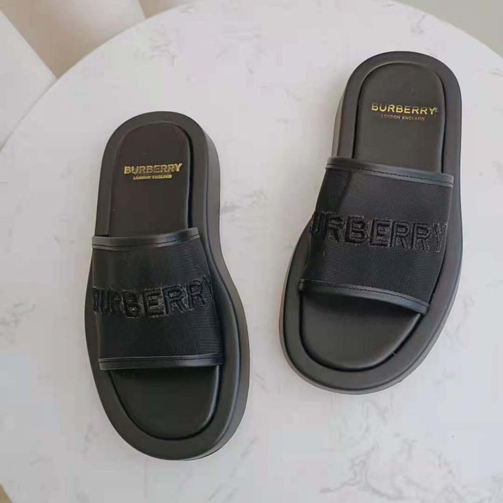 Top-down view showcasing open-toe design of Burberry mesh and leather slides