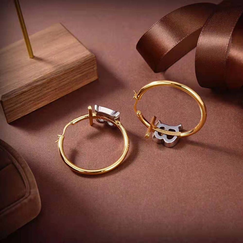 Detail shot of Burberry Women Gold and Palladium-plated Monogram Motif Earrings monogram motif