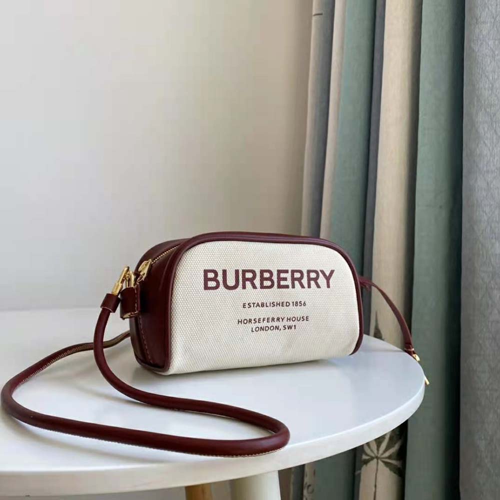 Side angle showing silhouette and adjustable strap of Burberry Women Horseferry Print Canvas Half Cube Crossbody Bag