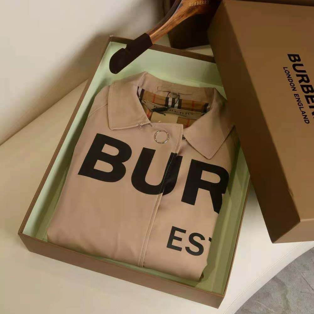 Close-up of button and Horseferry print lining inside the Burberry car coat