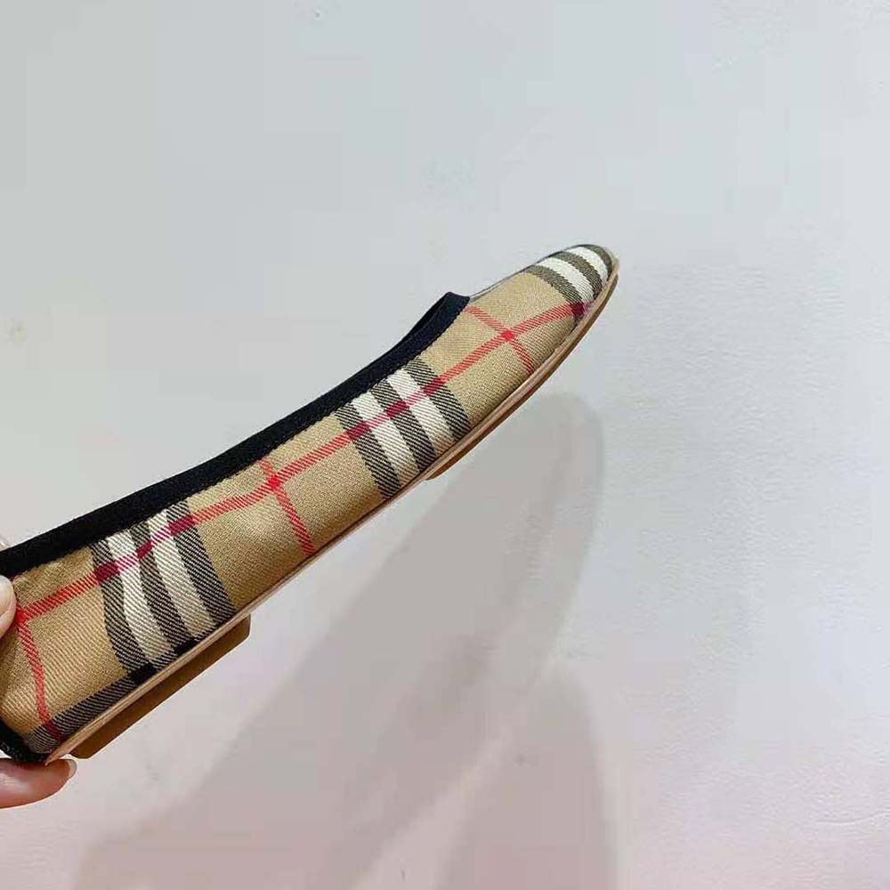 Overhead shot showing vintage check pattern on brown cotton ballerinas