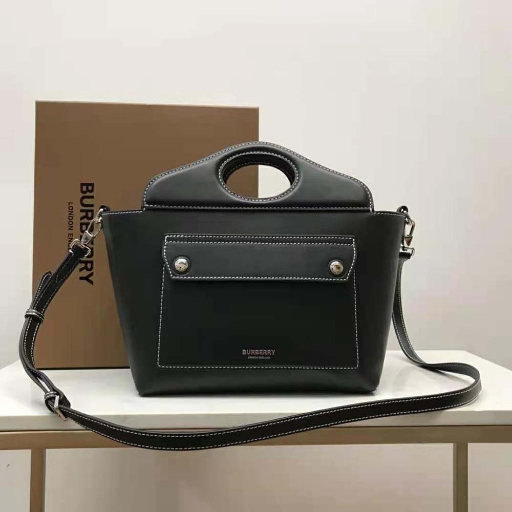 Close-up of silver hardware on Burberry Women Mini Leather Soft Pocket Tote-Black