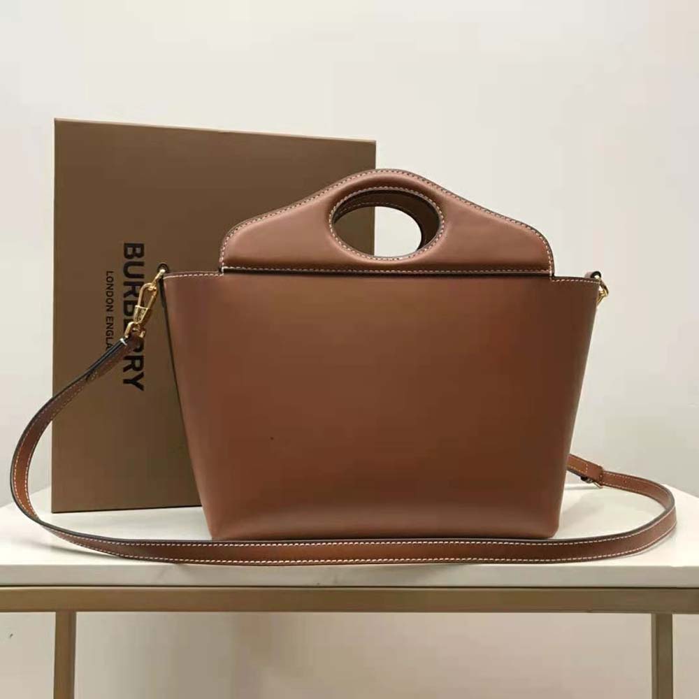 Side profile showing soft leather texture of Burberry Women Mini Leather Soft Pocket Tote-Brown