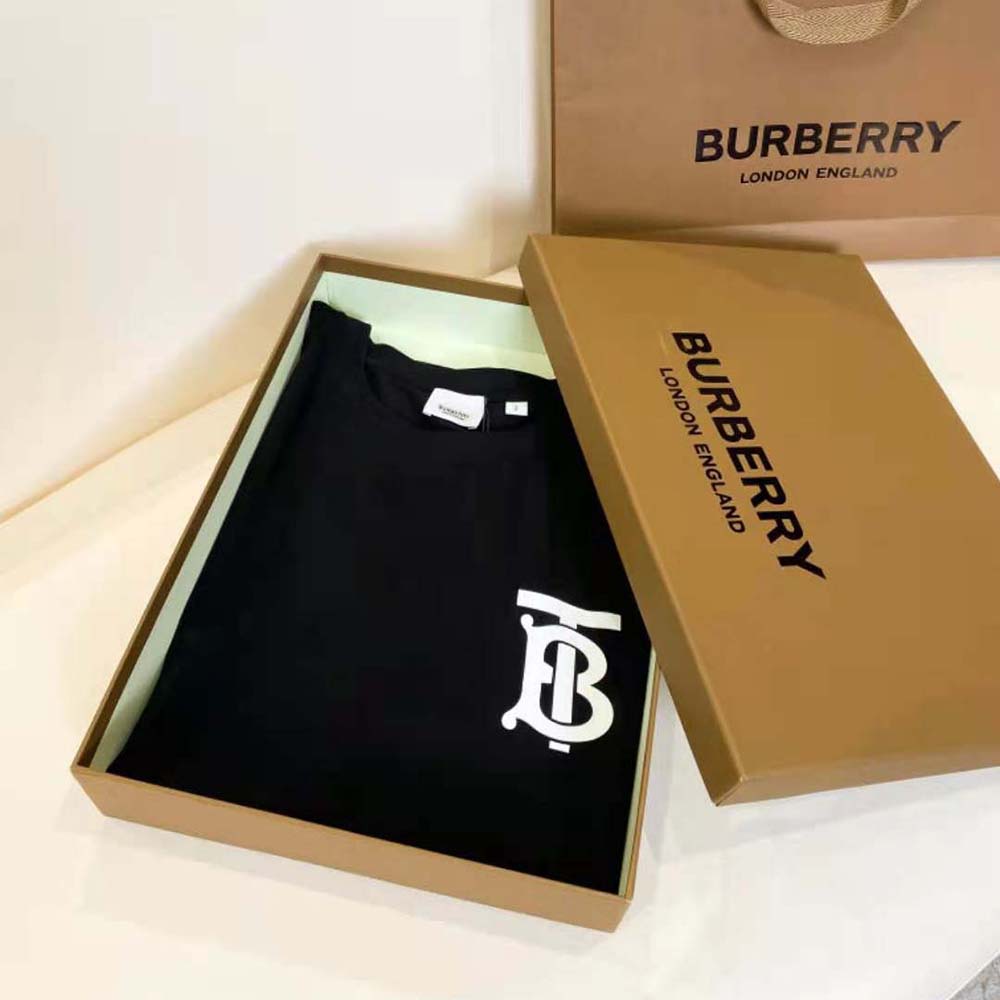 Close-up of Burberry monogram motif on black oversized T-shirt