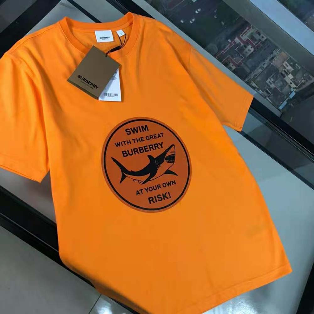 Close-up detail of shark graphic on Burberry Men Oversized T-shirt in orange