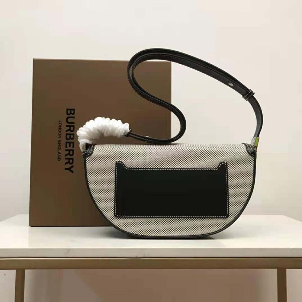 Side angle showing silhouette and adjustable strap of Burberry Olympia Bag