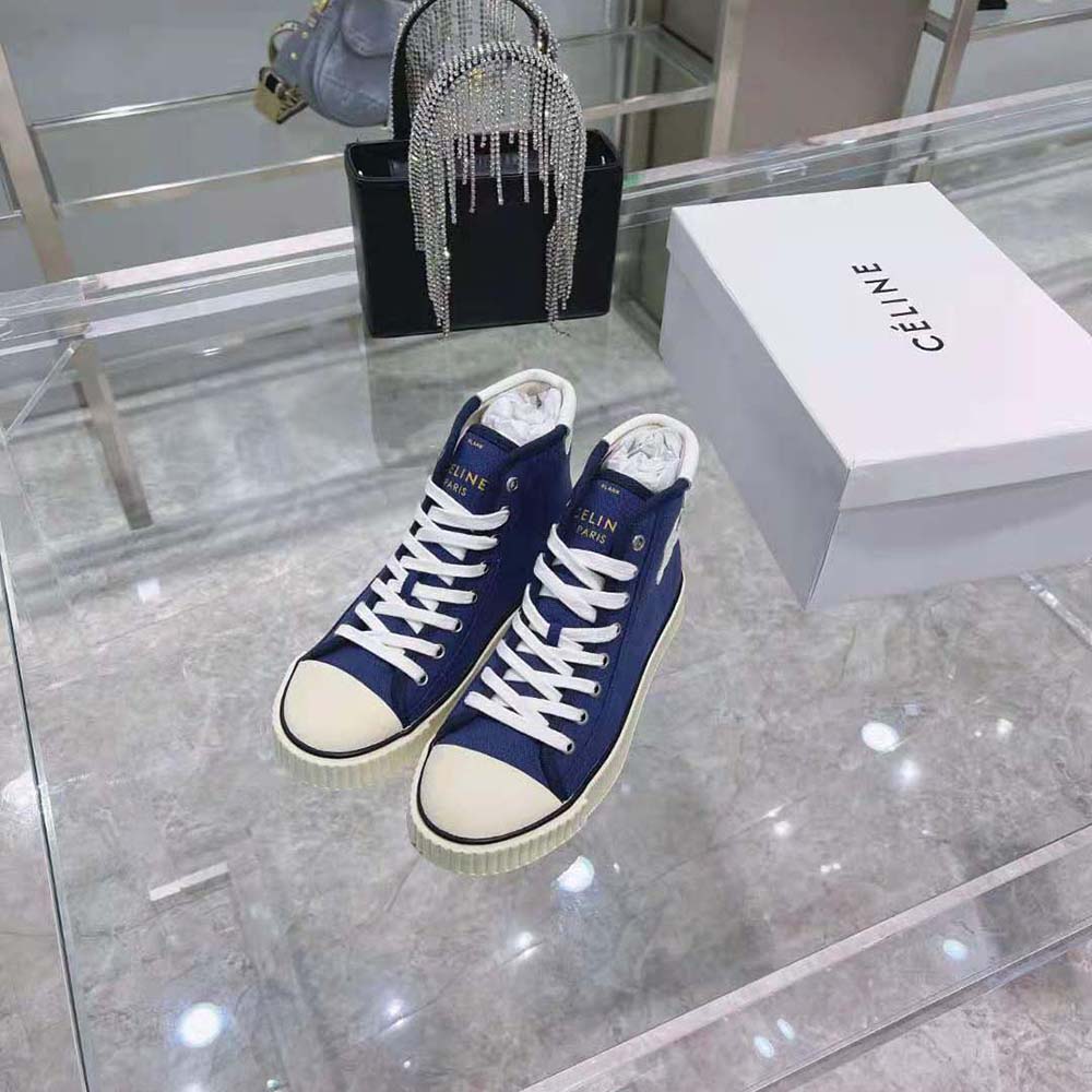 Close-up on lace-up detail of Celine Women Blank Mid Lace up Sneaker
