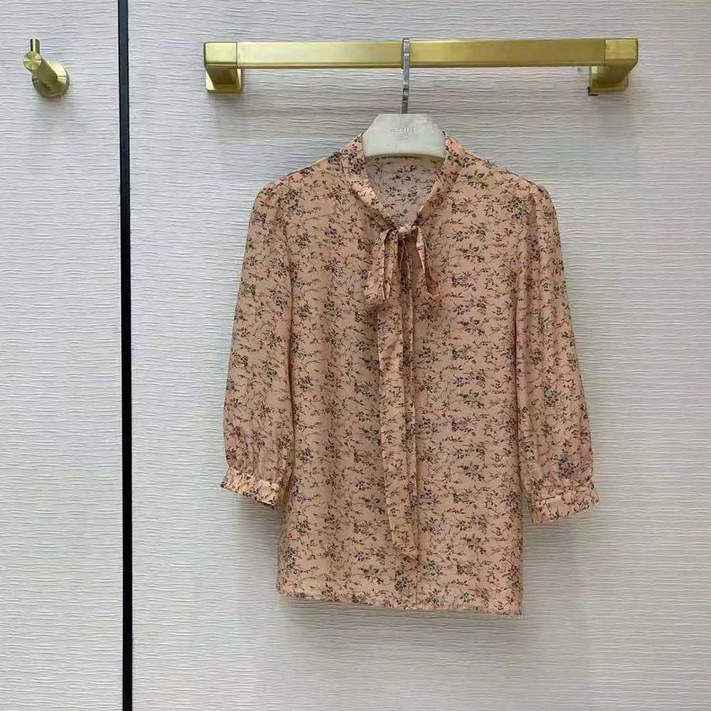 Close-up detail of bow and fabric print on Celine blouse