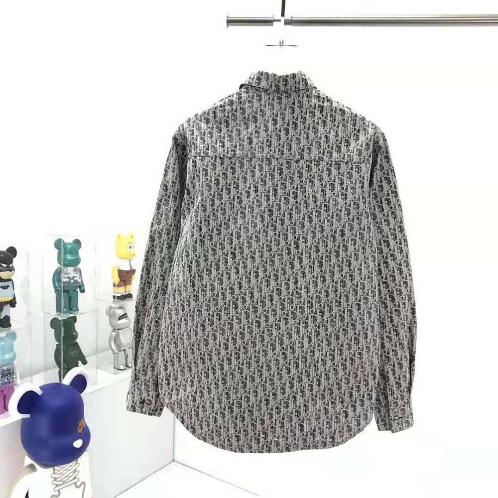 Detail of silver hardware and button closure on Dior Men Dior Oblique Overshirt