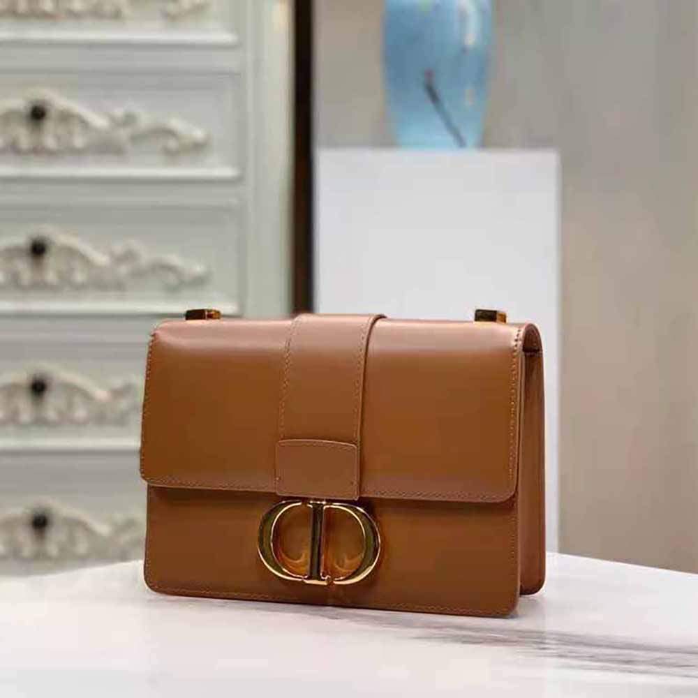 Side angle showing shape of Dior Women 30 Montaigne Bag Des Vents