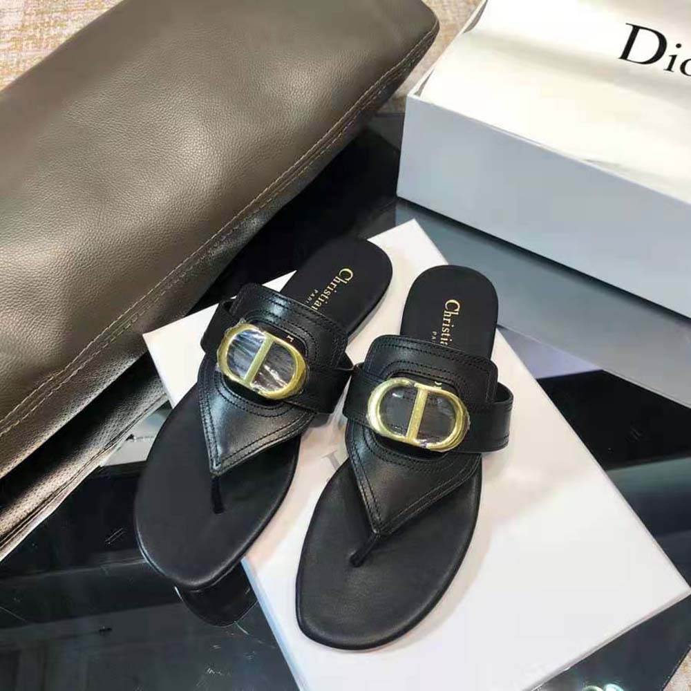 Close-up of black calfskin and Dior signature on sandal strap