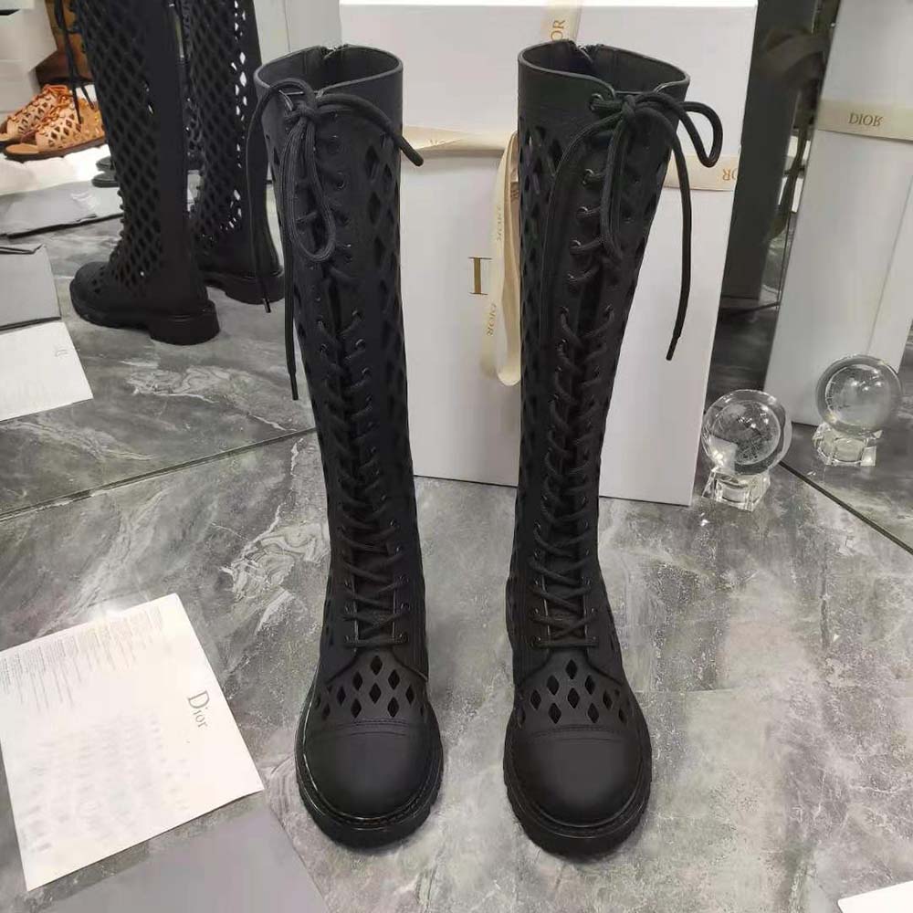 Close-up of embossed Dior hardware on D-Trap Boot