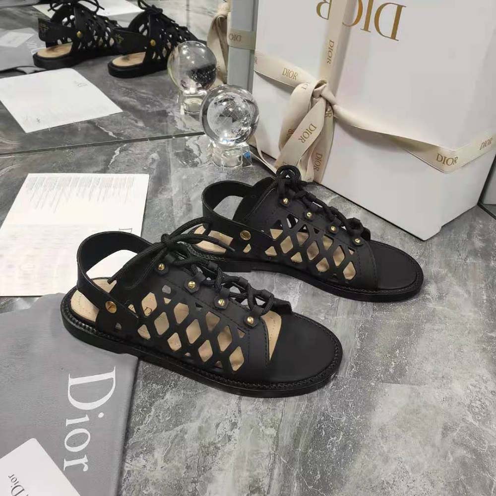 Close-up of silver Dior hardware on D-Trap Sandal in black calfskin