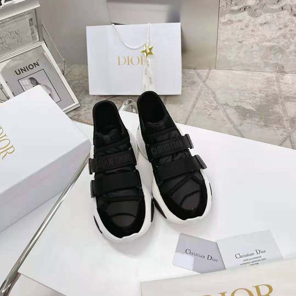 Close-up detail of Dior branding and lace-up on D-Wander sneaker