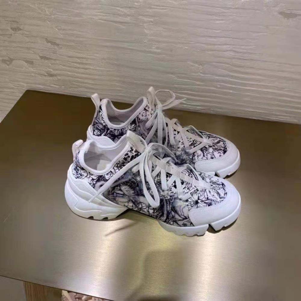 Close-up of zodiac print and silver Dior hardware on sneaker