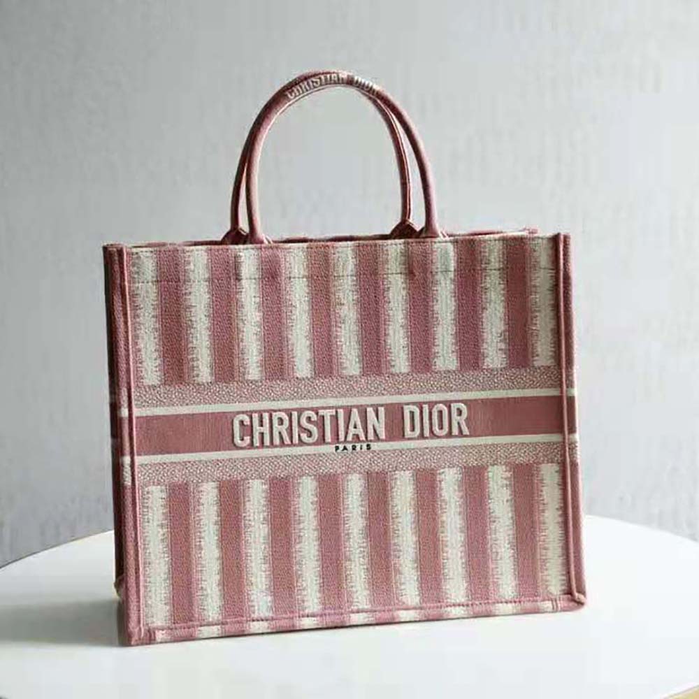 Close-up of pink embroidered D-stripes on Dior Women Dior Book Tote