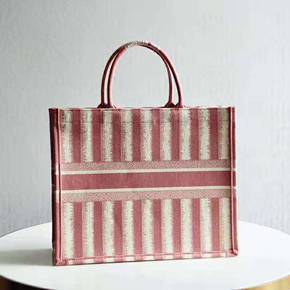 Side angle showing silhouette of Dior Women Dior Book Tote Pink D-Stripes Embroidery
