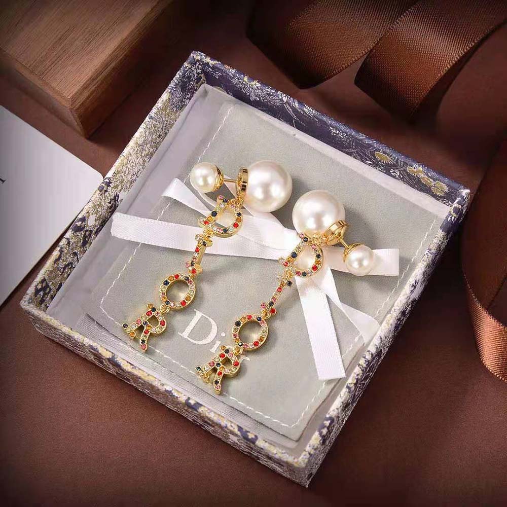 Close-up detail of white resin pearls on Dior Women Dior Tribales Earrings