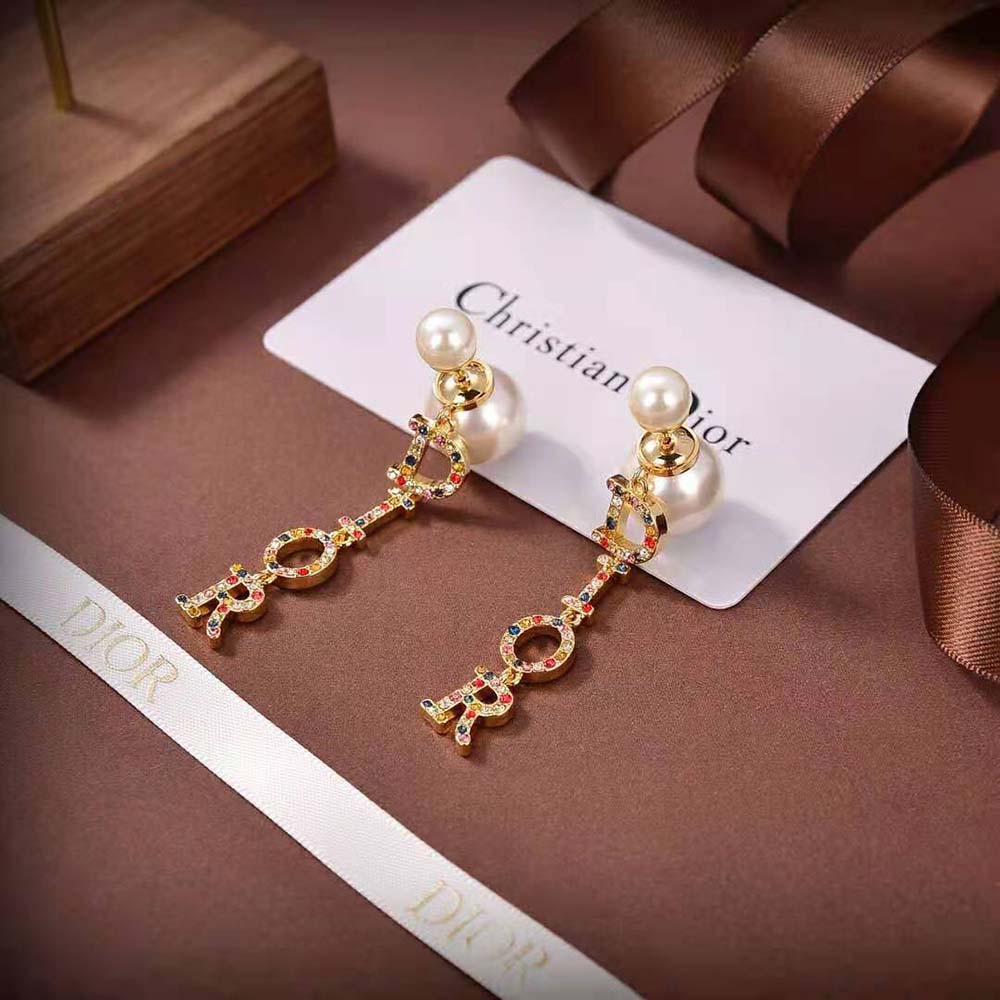 Side angle showcasing gold-finish metal and closure on Dior Tribales Earrings