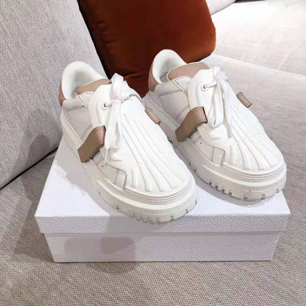 Close-up of silver-tone hardware on Dior Women Dior-id Sneaker laces