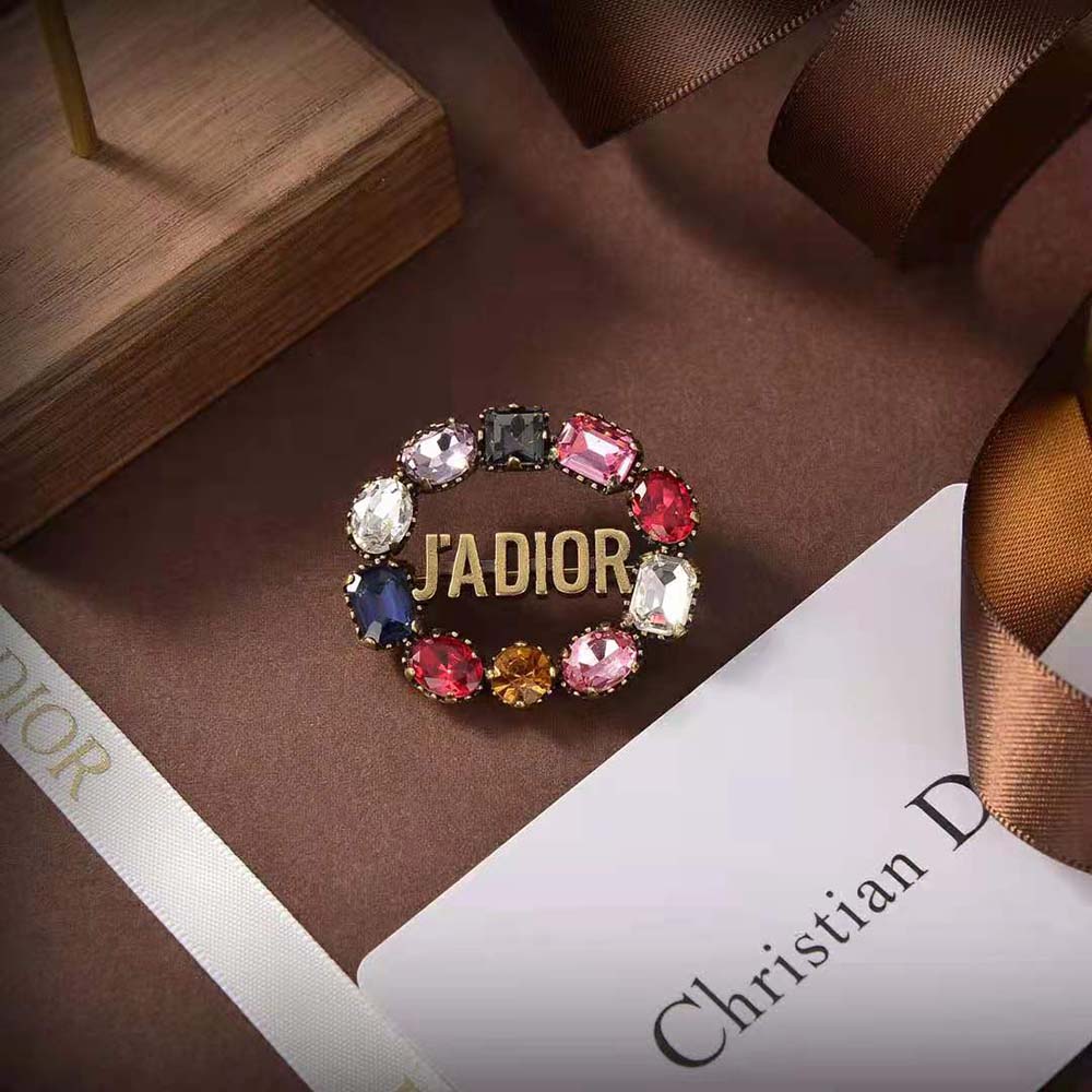 Angled view of Dior Women J’Adior Brooch highlighting antique gold-finish metal