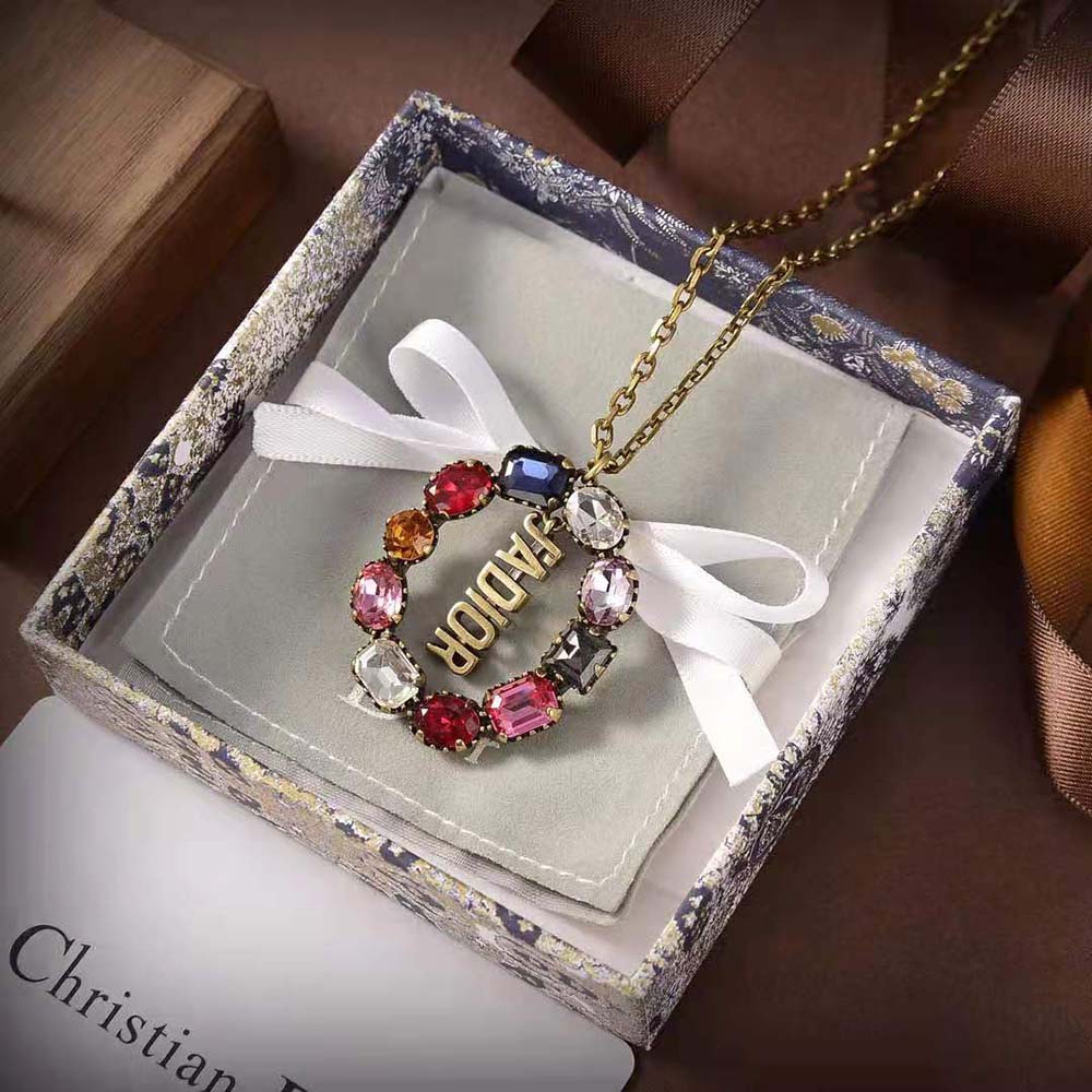 Close-up on multicolor crystals of Dior Women J’Adior Necklace in antique gold