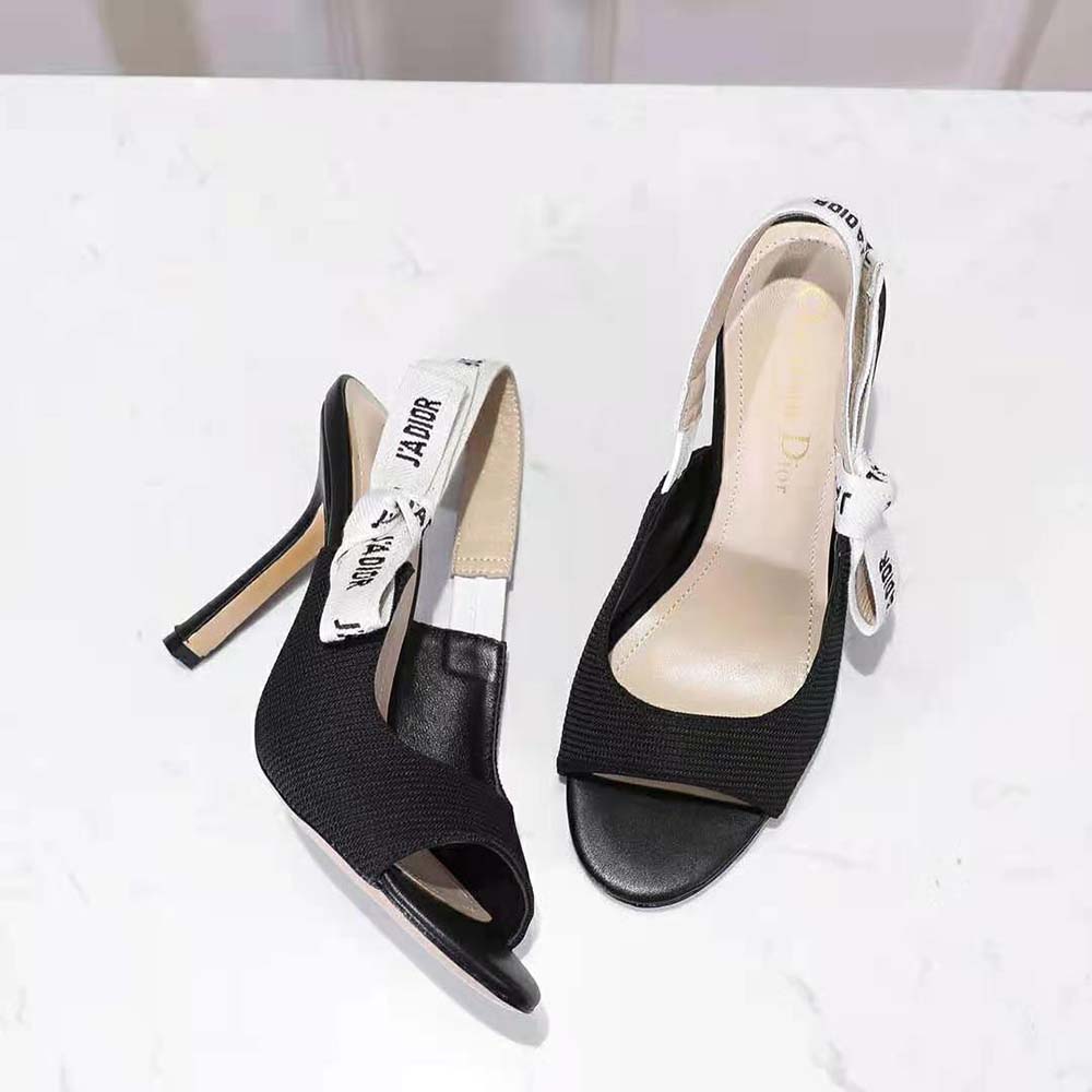 Close-up of black technical fabric and metal J’adior buckle on sandal