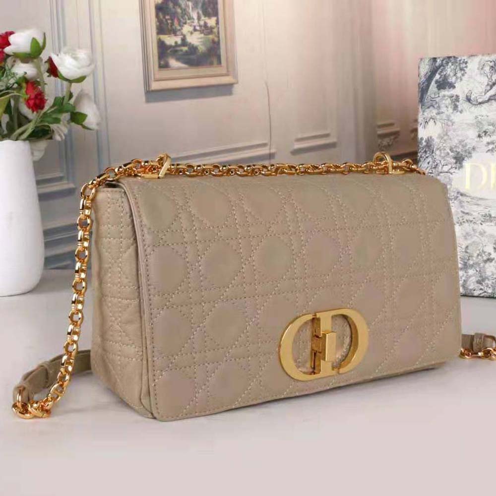 Side angle showing silhouette of Dior Women Large Dior Caro Bag Beige leather