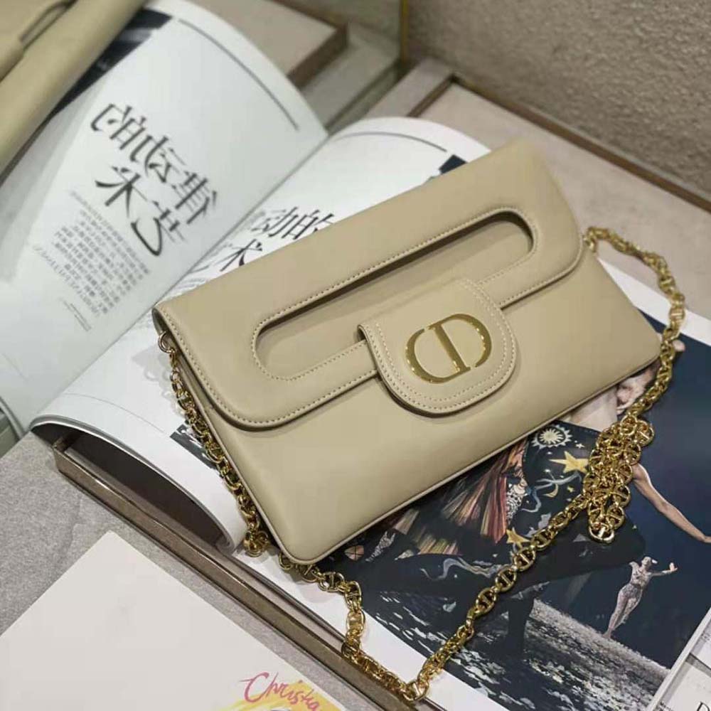 Side angle showing smooth beige calfskin texture on Dior Women Medium Diordouble Bag