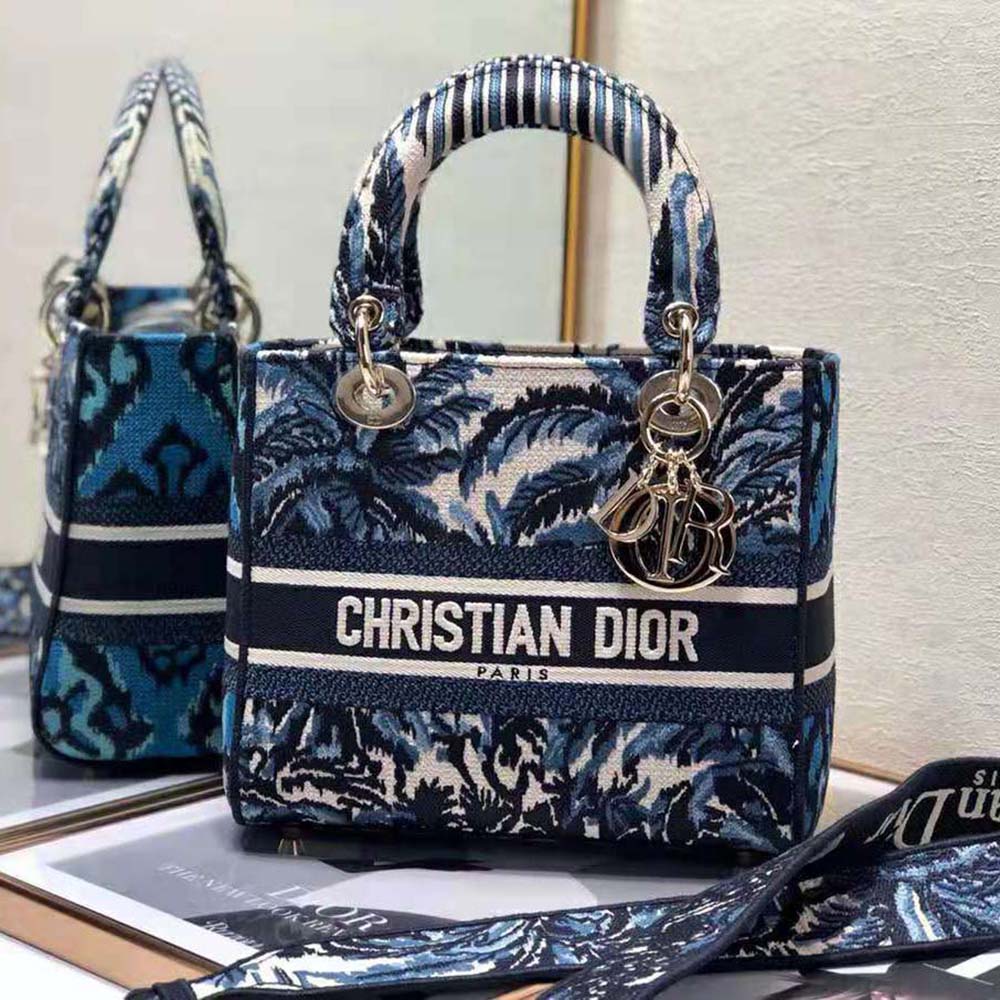 Close-up of palms embroidery and silver clasp on Dior Medium Lady D-lite Bag