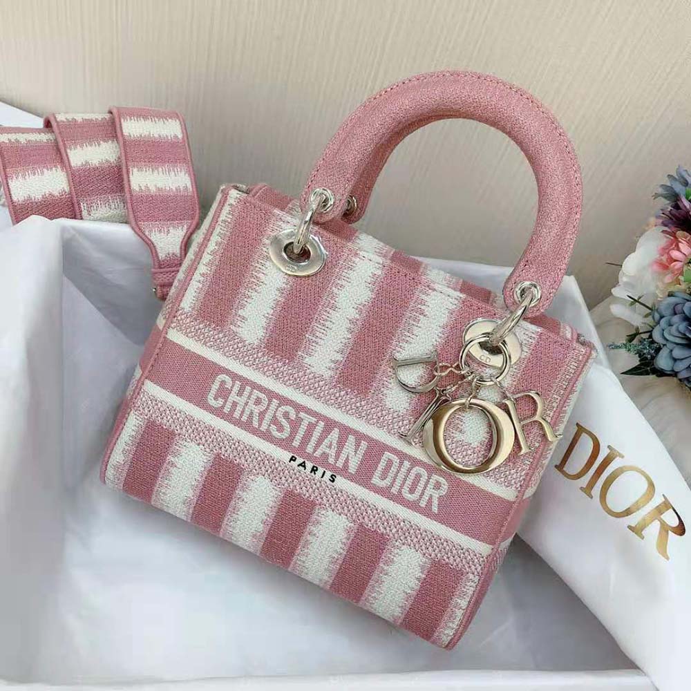 Close-up of gold hardware and pink embroidery on Dior Women Medium Lady D-lite Bag
