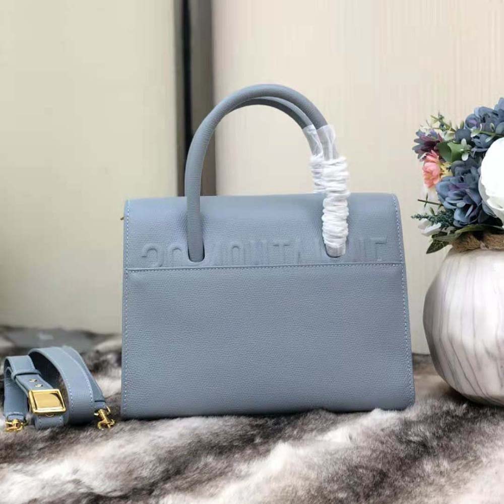 Side profile showing silhouette of Dior Women Medium ST Honore Tote in blue