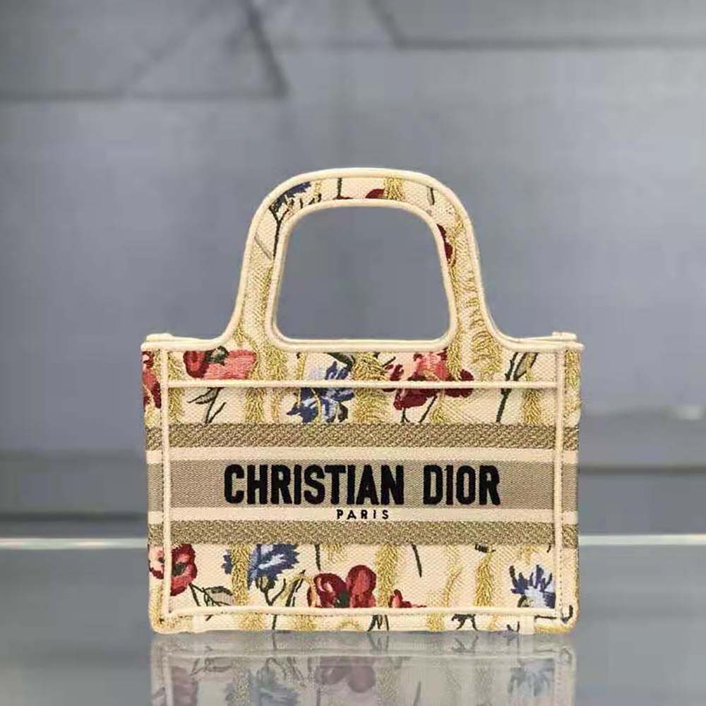 Close-up of multicolor hibiscus embroidery on Mini Dior Book Tote by Dior Women