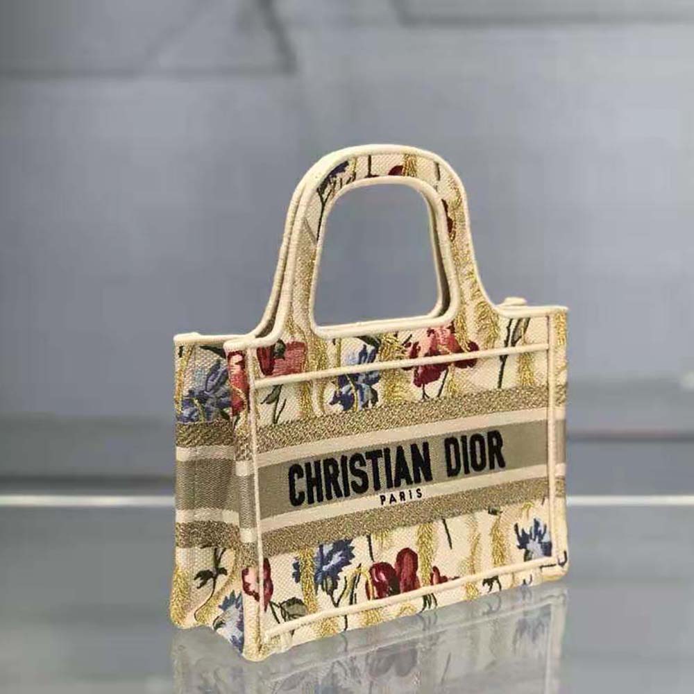 Side angle showing gold-tone hardware on Dior Women Mini Dior Book Tote Beige