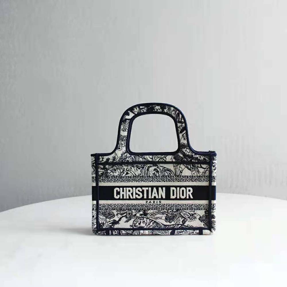 Close-up detail of blue toile embroidery on Dior Women Mini Dior Book Tote