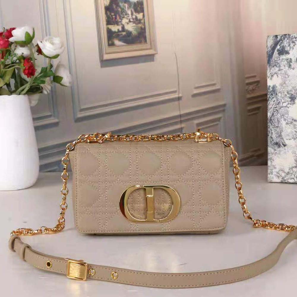 Close-up of silver-tone CD clasp on Dior Women Small Dior Caro Bag Beige