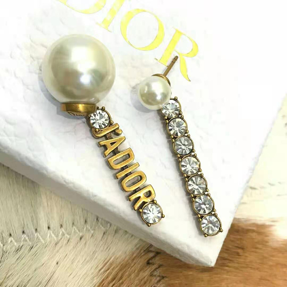 Side angle showing double-sided silhouette of Dior Women Tribales Earrings