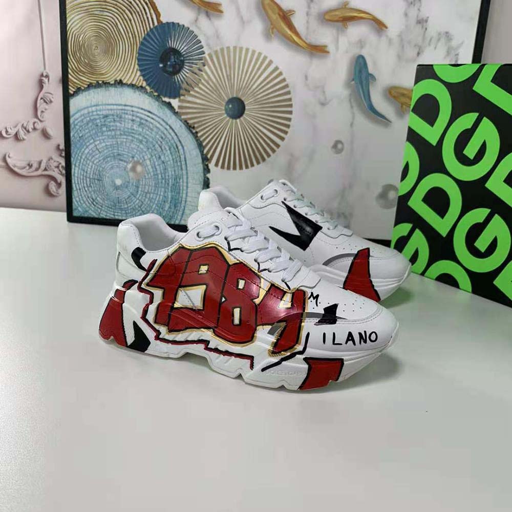 Close-up of hand-painted red calfskin and D&G embossed logo on sneakers
