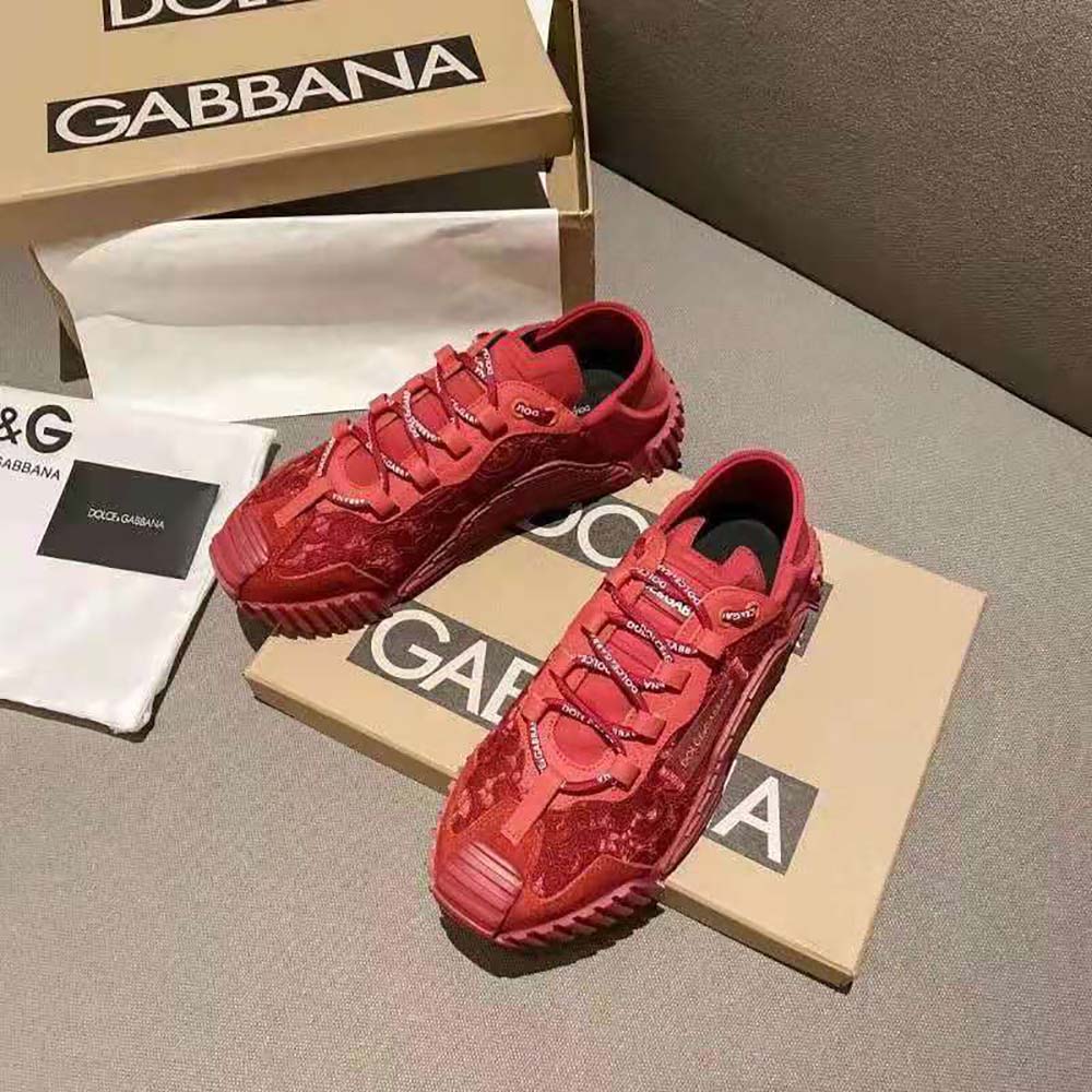 Close-up of red mixed materials and D&G logo on sneakers